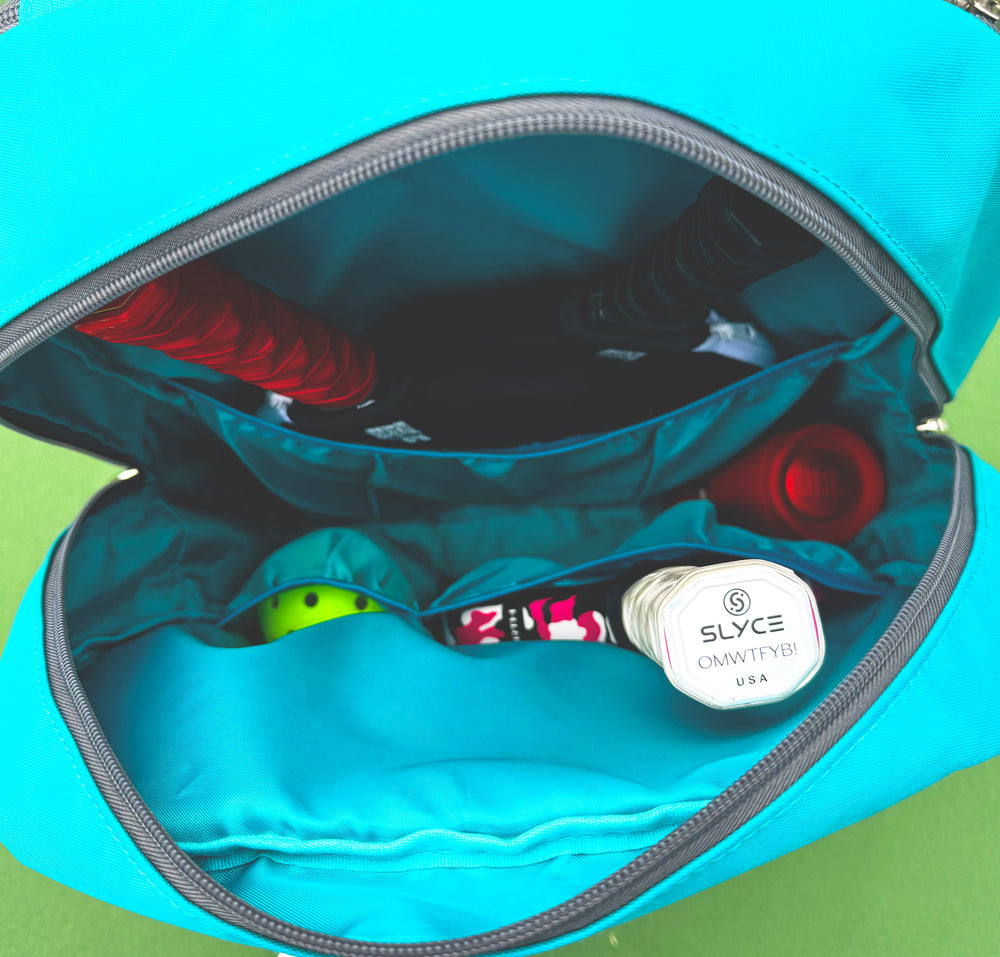 Spacious interior showing pockets for paddles, balls, and accessories