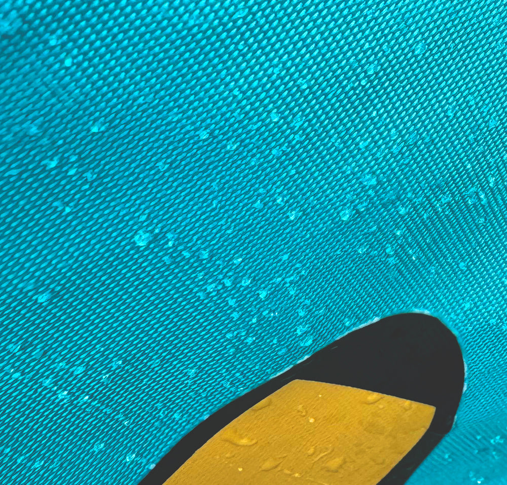 Close-up of water-resistant fabric with droplets